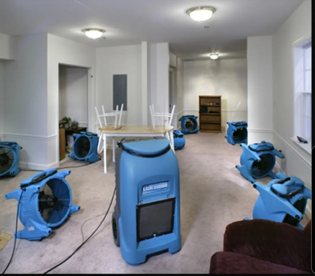 Air movers and dehumidifier setup for Water Damage Restoration in Minot
